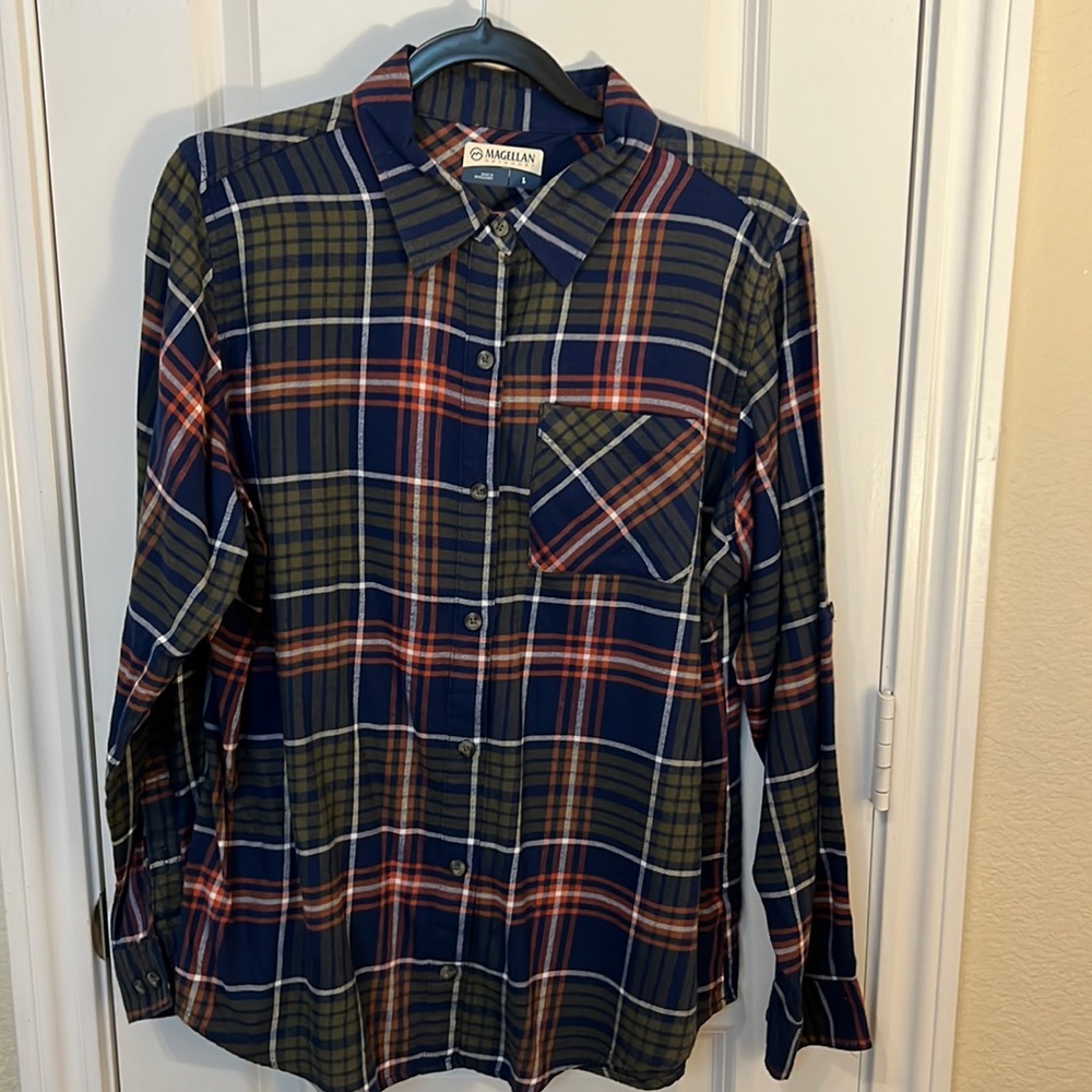 Long sleeve button up shirt. Sleeves can be rolled up or worn down.